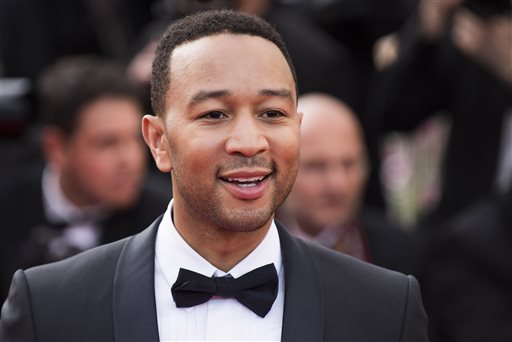 In this May 13, 2015 file photo, John Legend arrives for the opening ceremony and the screening of the film "La Tete Haute" (Standing Tall), at the 68th international film festival, Cannes, southern France. Legend is bringing his talents to a TV drama about Southern slaves fighting for freedom. WGN America said Wednesday, July 29, 2015, that Legend and his production company will be in charge of the score and soundtrack for "Underground."  (Photo by Arthur Mola/Invision/AP, File)