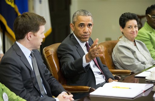 President Barack Obama, center, with Paul Sullivan, left, Vice President of International Business Development at Acrow Bridge, and Susan Jaime, right, CEO Ferra Coffee International, during his meeting with small business owners to discuss the importance of the reauthorization of the Export-Import Bank in the Roosevelt Room of the White House in Washington, Wednesday, July 22, 2015. Obama is ramping up pressure on Congress to reauthorize the Export-Import Bank, the obscure federal agency's charter expired last month after lawmakers refused to reauthorize it. The bank underwrites loans to foreign companies purchasing American products, but conservatives call it corporate welfare. (AP Photo/Pablo Martinez Monsivais)