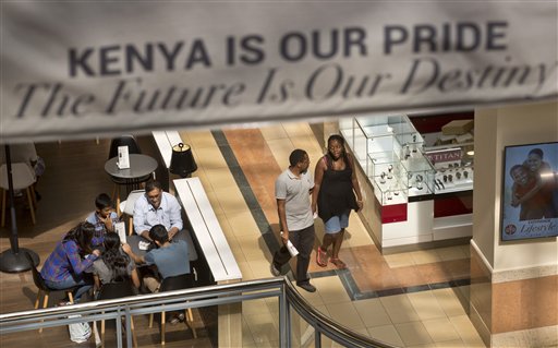 Shoppers return to the reopened Westgate Shopping Mall, nearly two years after a terrorist attack there left at least 67 people dead, in the capital Nairobi, Kenya Saturday, July 18, 2015. Hundreds of shoppers thronged through the reopened mall Saturday, following two years of repairs after security forces battled four gunmen from Somalia's al-Qaida-linked al-Shabab militant group there in September 2013. (AP Photo/Ben Curtis)