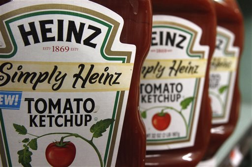 FILE - This March 2, 2011, file photo, shows containers of Heinz ketchup on the shelf of a market, in Barre, Vt.  Kraft shareholders have approved the sale of the company to ketchup maker H.J. Heinz, creating one of the world's largest food companies with annual revenue of about $28 billion. (AP Photo/Toby Talbot, File)