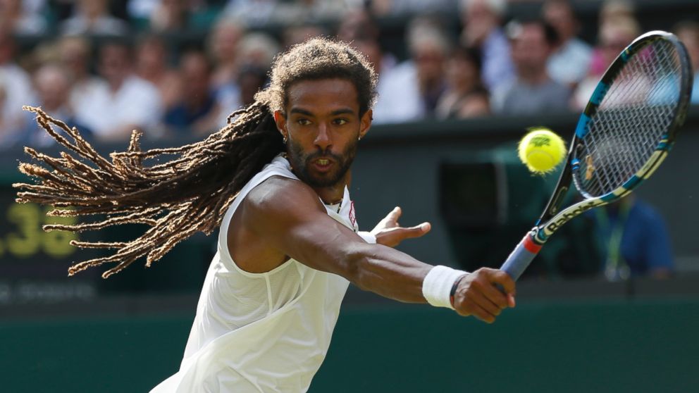 Dustin Brown of Germany returns a ball to Rafael Nadal of Spain during their singles match at the All England Lawn Tennis Championships in Wimbledon, London, Thursday July 2, 2015. (AP Photo/Pavel Golovkin)