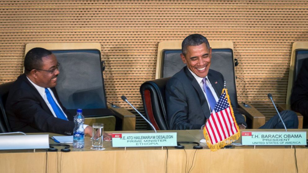 President Barack Obama smiles as he listens to Ethiopia's Prime Minister Hailemariam Desalegn, left, before Obama delivered a speech to the African Union in Addis Ababa, Ethiopia Tuesday, July 28, 2015. Closing a historic visit to Africa, President Barack Obama on Tuesday urged the continent's leaders to prioritize creating jobs and opportunity for the next generation of young people or risk sacrificing future economic potential to further instability and disorder. (AP Photo/Mulugeta Ayene)