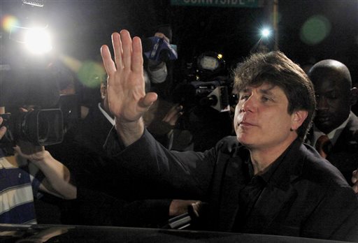 In this March 15, 2012 file photo, former Illinois Gov. Rod Blagojevich waves as he departs his Chicago home for Littleton, Colo., to begin his 14-year prison sentence on corruption charges. The 7th U.S. Circuit Court of Appeals in Chicago on Tuesday, July 21, 2015, tossed out some of Blagojevich's convictions that he sought to sell or trade President Barack Obama's old U.S. Senate seat. (AP Photo/Charles Rex Arbogast, File)