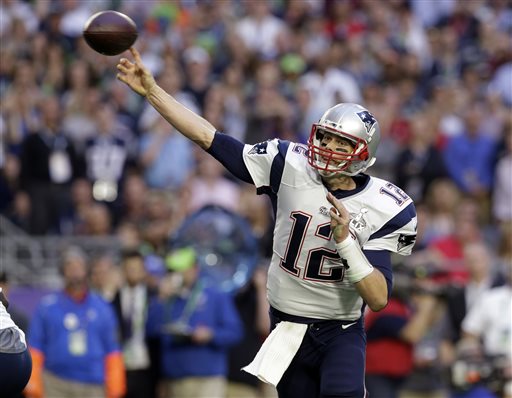 In this Feb. 1, 2015, file photo, New England Patriots quarterback Tom Brady (12) throws a pass during the first half of the NFL Super Bowl XLIX football game against the Seattle Seahawks in Glendale, Ariz. (AP Photo/Patrick Semansky)