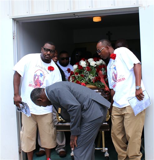 Pallbearers bring out the casket containing the body of Stonewall, Miss., resident Jonathan Sanders following his funeral services Saturday, July 18, 2015, at the Family Life Center in Quitman, Miss. Sanders, who had been driving a horse and buggy died after a fight with a Stonewall police officer. (Jeff Byrd/The Meridan Star via AP) 