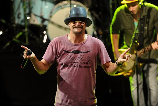 This May 5, 2015 file photo shows musician Kid Rock performing during  National Concert Day in New York. Activists in Detroit trying to persuade Kid Rock to stop displaying the Confederate flag at concerts plan to meet this week with General Motors over the Chevrolet brand's sponsorship of the musician's summer tour. (Photo by Brad Barket/Invision/AP, File)