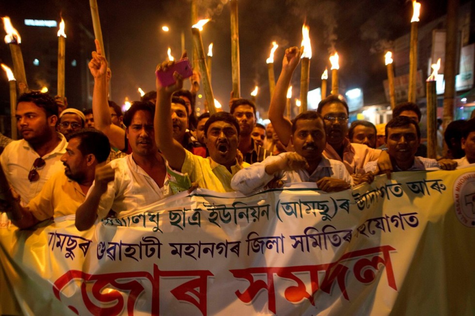 Activists hold a torch protest against the lynching of a man accused of rape in Gauhati. (AP Photo)