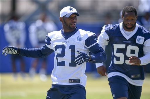 In this Aug. 4, 2015, file photo, Dallas Cowboys running back Joseph Randle (21) and outside linebacker Anthony Hitchens (59) run a  play during Dallas Cowboys' NFL training camp in Oxnard, Calif. Randle started training camp as the front-runner to replace NFL rushing champion DeMarco Murray in Dallas. With injuries affecting other candidates, the third-year back might be the last man standing. (AP Photo/Gus Ruelas, File)