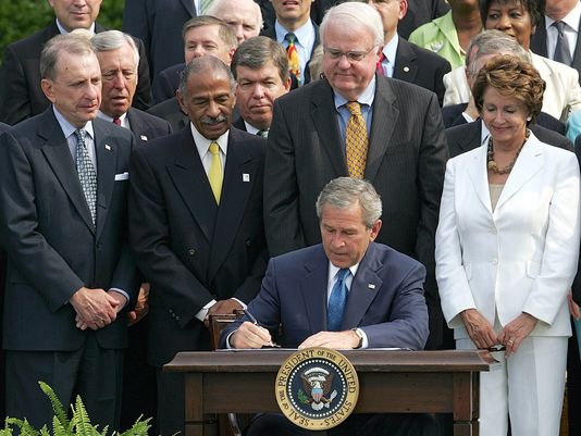 President Bush signs the renewal of the Voting Rights Act in 2006. (Ron Edmonds/AP Photo)