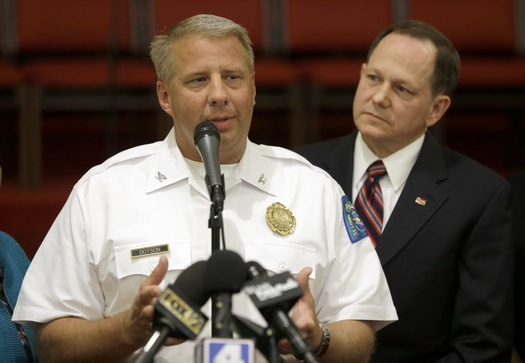 St. Louis police chief Sam Dotson, left, appeals for calm alongside mayor Francis Slay, Thursday, Aug. (Jeff Roberson/AP)