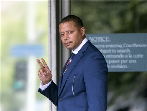In this Thursday, Aug. 13, 2015, file photo, actor Terrence Howard walks into a Los Angeles court for a hearing regarding a divorce settlement with his ex-wife Michelle Ghent. A judge will determine whether Howard can overturn a divorce settlement with his second wife because of his claims she extorted him to sign the agreement by threatening to leak private information, during a ruling expected on Monday, Aug. 24, 2015. (AP Photo/Damian Dovarganes, File)