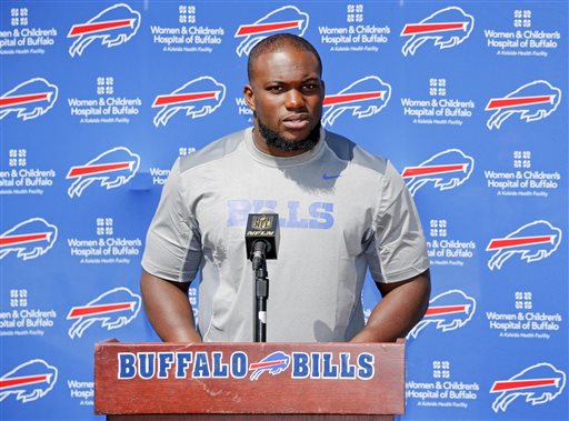 Buffalo Bills' IK Enemkpali, released this week by the New York Jets, speaks to the media at NFL football training camp, Thursday, Aug. 13, 2015, in Pittsford, N.Y. The Bills claimed the second-year player off of waivers on Wednesday, a day after he was released by the Jets because he hit quarterback Geno Smith with a sucker punch, breaking his jaw. (AP Photo/Mike Groll)