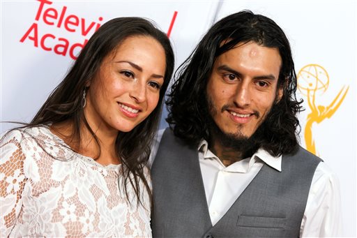 Janiece Sarduy, left, and Richard Cabral arrive at the 2015 Dynamic and Diverse Emmy Celebration at the Montage Hotel on Thursday, Aug. 27, 2015, in Beverly Hills, Calif. (Photo by Rich Fury/Invision/AP)