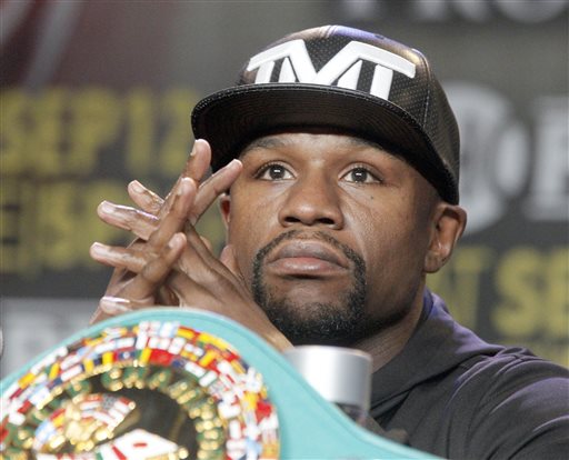 Floyd Mayweather Jr. takes questions during a news conference in Los Angeles on Thursday, Aug. 6, 2015. Mayweather is scheduled to face Andre Berto in a boxing bout Sept. 12 in Las Vegas. (AP Photo/Nick Ut)