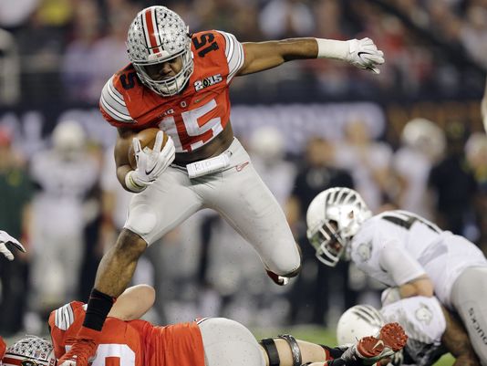 Ezekiel Elliott (15) is one of at least three potential legitimate Heisman trophy candidates on Ohio State's roster. (Eric Gay/AP Photo)