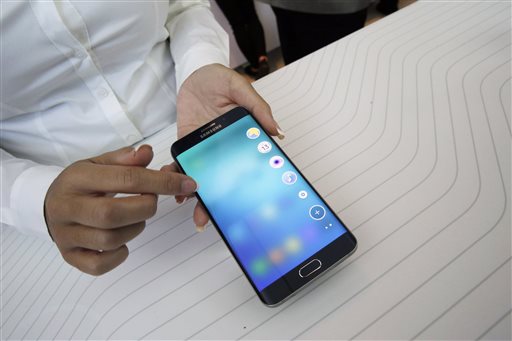 A product expert demonstrates the Samsung Galaxy S6 Edge Plus during a presentation, Thursday, Aug. 13, 2015, at Lincoln Center in New York. (AP Photo/Mary Altaffer)