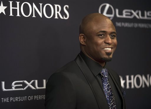 In this Saturday, Jan. 24, 2015, file photo, Wayne Brady arrives on the red carpet at the BET Honors 2015 at Warner Theater on in Washington. Producers of Kinky Boots said Brady, the Lets Make a Deal host, will step into the high heels of the cross-dressing Lola, on Broadway, starting Nov. 21, 2015. It is Brady's first return to Broadway since he made his debut in 2004 in Chicago. (Photo by Kevin Wolf/Invision/AP, File)