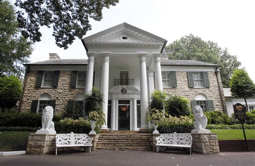 This August 2010 file photo, shows Graceland, Elvis Presley's home in Memphis, Tenn. Over a hundred authenticated artifacts are up for auction Thursday, Aug. 13, 2015, as part of Elvis Week at Graceland. (AP Photo/Mark Humphrey, File)