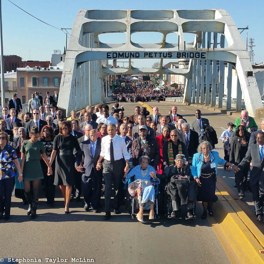 Boynton, in wheelchair next to President Obama, at 50th anniversary celebration of the Selma to Montgomery March (Photo by Stephonia Taylor McLinn)