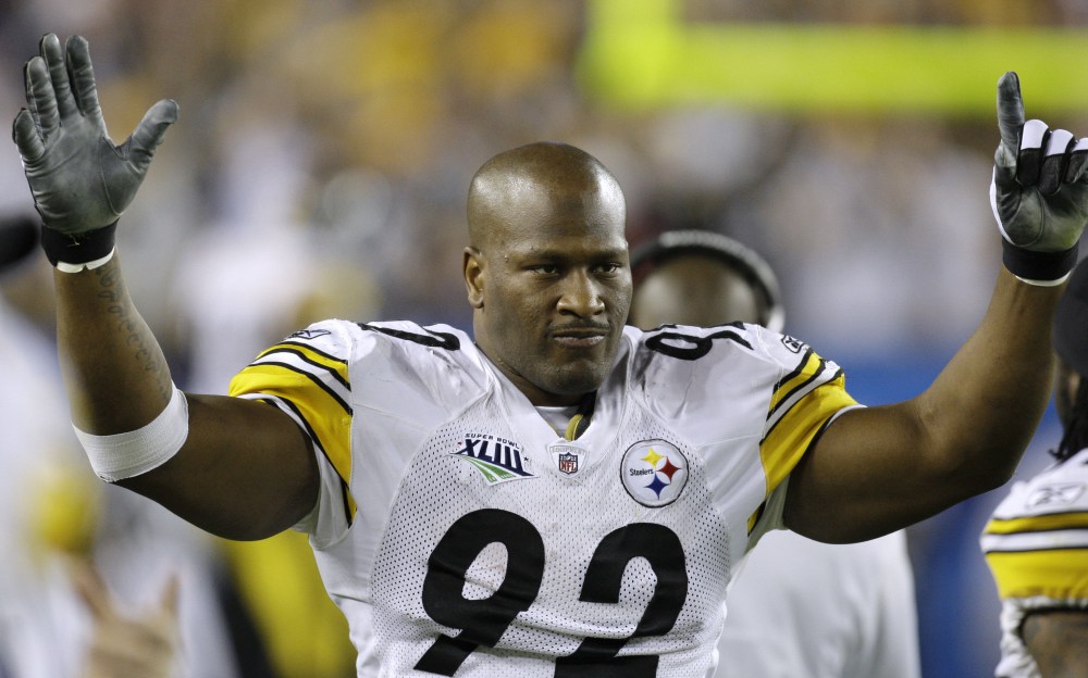 FILE - In this Feb. 1, 2009, file photo, Pittsburgh Steelers linebacker James Harrison celebrates after returning an interception 100 yards for a touchdown during the second quarter of the NFL Super Bowl XLIII football game against the Arizona Cardinals in Tampa, Fla. The former Steelers linebacker is officially retiring on Friday, Sept. 5, 2014, ending an 11-year career that included five Pro Bowls, two Super Bowl rings and numerous run ins with the NFL front office. (AP Photo/Chris O'Meara, File)