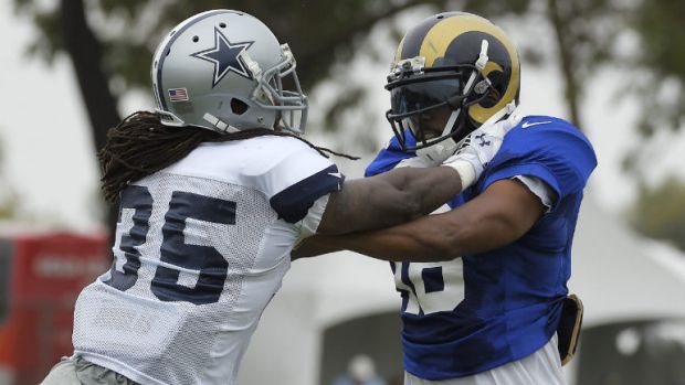 Dallas Cowboys cornerback Brandon Smith, left, scuffles with St. Louis Rams wide receiver Emory Blake during a joint NFL football training camp, Monday, Aug. 17, 2015, in Oxnard, Calif. (AP Photo/Mark J. Terrill)