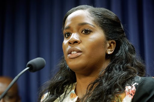 State Rep. Jehan Gordon-Booth, D-Peoria, speaks to reporters during a news conference at the Illinois State Capitol Wednesday, Aug. 12, 2015, in Springfield, Ill. Illinois has become among the first states nationwide to establish wide-ranging law enforcement rules for body cameras, bias-free policing and more data collection on arrests under a measure signed into law Wednesday by Gov. Bruce Rauner. (AP Photo/Seth Perlman)