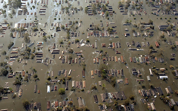 Water engulfs homes just east of downtown New Orleans, the day after Hurricane Katrina made landfall. (AP Photo)