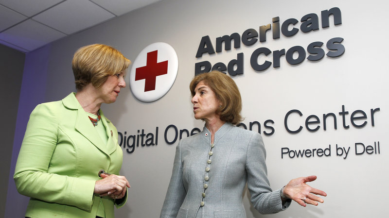 American Red Cross chief Gail McGovern (right) and Rep. Susan Brooks of Indiana tour the American Red Cross Digital Operations Center last year in Washington, D.C. (Paul Morigi/AP Images for American Red Cross)