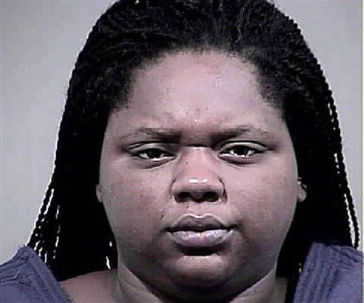 This photo provided by the Charles County, Md. Sheriff's Office shows Romechia Simms. Simms, who was found pushing her dead son in a playground swing earlier this year, has been indicted and charged with manslaughter and child abuse, authorities announced Monday, Sept. 14, 2015. (Charles County, Md. Sheriff's Office via AP)