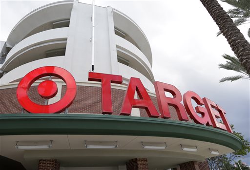 This Monday, Aug. 11, 2015, file photo, shows a Target store in Miami. Target has teamed with Instacart to launch a grocery delivery service in Minneapolis, beginning Tuesday, Sept. 15, 2015. Target said it's exploring plans to expand to other markets. (AP Photo/Lynne Sladky, File)
