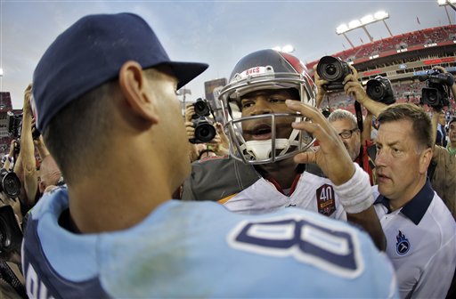 Tampa Bay Buccaneers quarterback Jameis Winston, right, congratulates Tennessee Titans quarterback Marcus Mariota after the Titans defeated the Buccaneers 42-14 during an NFL football game Sunday, Sept. 13, 2015, in Tampa, Fla. (AP Photo/Chris O'Meara)