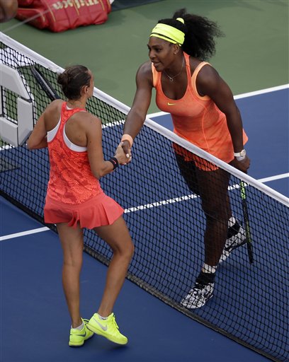 Roberta Vinci, of Italy, left, greets Serena Williams after winning their semifinal match at the U.S. Open tennis tournament, Friday, Sept. 11, 2015, in New York. (AP Photo/Seth Wenig)
