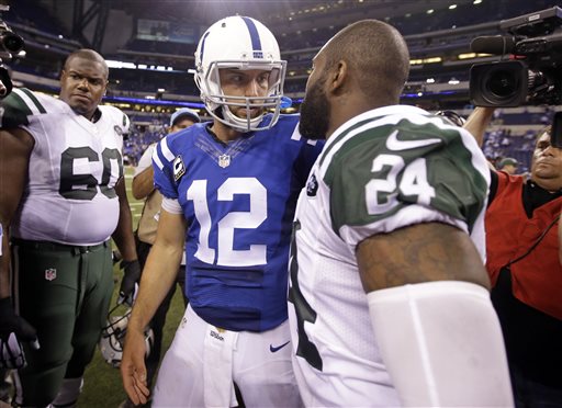 New York Jets cornerback Darrelle Revis (24) greets Indianapolis Colts quarterback Andrew Luck (12) following an NFL football game in Indianapolis, Monday, Sept. 21, 2015. The Jets defeated the Colts 20-7. (AP Photo/Darron Cummings)