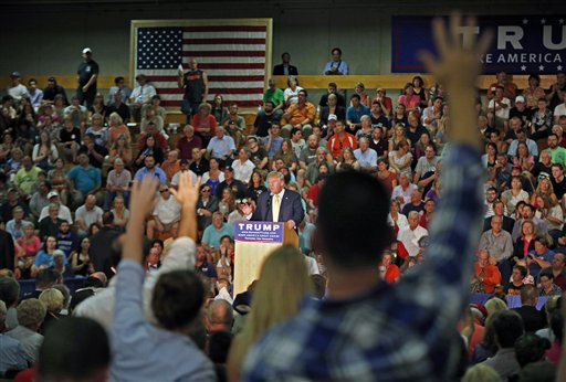 Audience members raise their hands during a question and answer session with Republican presidential candidate Donald Trump at a town hall event Thursday, Sept. 17, 2015, in Rochester, N.H. (AP Photo/Robert F. Bukaty)