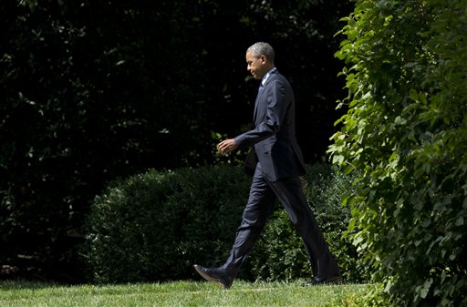 President Barack Obama, walks from the Oval Office of the White House in Washington, Wednesday, Sept. 9, 2015.  Obama is teaming up with Dr. Jill Biden, the wife of the vice president and a community college teacher, to visit Macomb County Community College in Warren, Michigan, on Wednesday. They planned to announce an independent College Promise Advisory Board, led by Biden, that will highlight existing programs providing free community college. (AP Photo/Manuel Balce Ceneta)