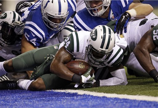 New York Jets cornerback Darrelle Revis (24) recovers a fumble by Indianapolis Colts running back Frank Gore (23) during the second half of an NFL football game in Indianapolis, Monday, Sept. 21, 2015. (AP Photo/AJ Mast)