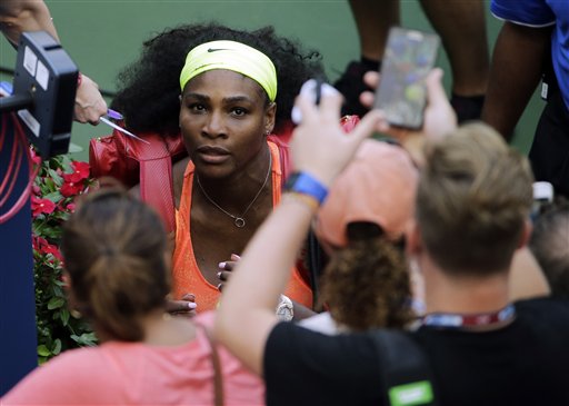 Serena Williams looks up at fans as she leaves the court after beating Kiki Bertens, of the Netherlands, during the second round of the U.S. Open tennis tournament, Wednesday, Sept. 2, 2015, in New York. (AP Photo/Matt Rourke)