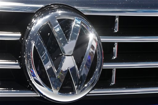 The VW Logo is photographed at a car  at the Car Show in Frankfurt, Germany, Tuesday, Sept. 22, 2015. Volkswagen has   admitted that it intentionally installed software programmed to switch engines to a cleaner mode during official emissions testing.  The software then switches off again, enabling cars to drive more powerfully on the road while emitting as much as 40 times the legal pollution limit. (AP Photo/Michael Probst)
