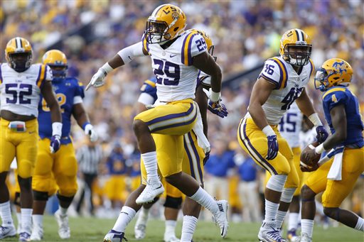 In this Sept. 5, 2015, file photo, LSU safety Rickey Jefferson (29) celebrates after sacking McNeese State quarterback Daniel Sams (4) during the first half of an NCAA college football game in Baton Rouge, La. (AP Photo/Jonathan Bachman, File)