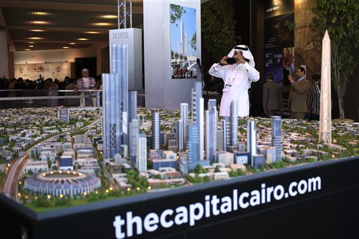In this Saturday, March 14, 2015 file photo, a model of a planned new capital for Egypt is on display at an economic conference in Sharm el-Sheikh, Egypt. President Abdel-Fattah el-Sissi's other major project trumpeted in March, aside from an extension of the Suez Canal, was the construction of a massive new capital city the size of Singapore, but that turned out to be little more than an opaque announcement. Plans are far from being finalized, and investment has yet to come in, although officials say they are still in discussions with China and the UAE. (AP Photo/Hassan Ammar, File)