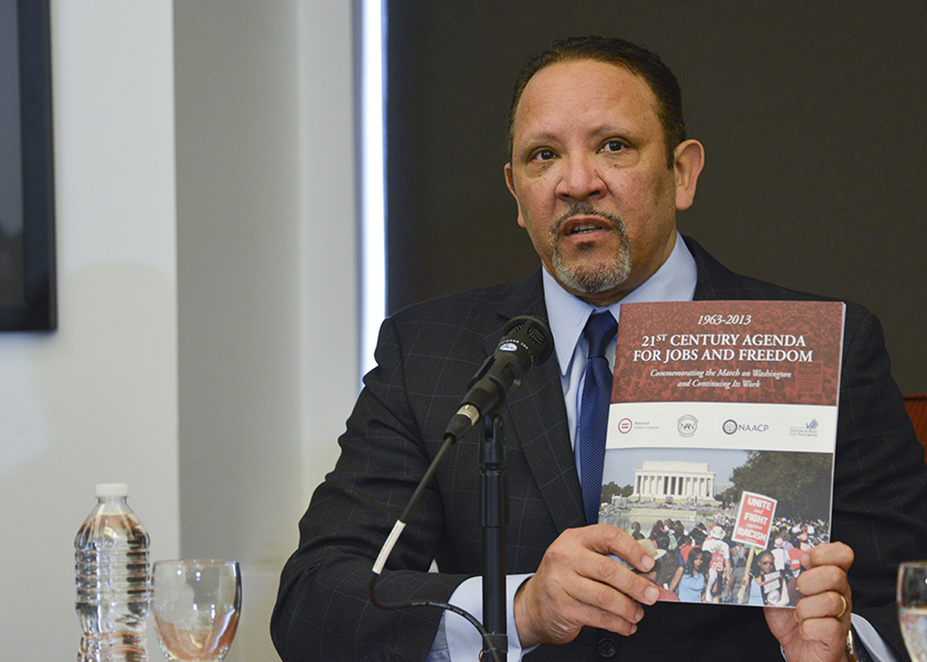 Marc Morial, the president and CEO of the National Urban League talks about the 21st Century Agenda for Jobs and Freedom during a meeting with presidential hopeful Hillary Clinton. (Freddie Allen/AMG/NNPA)