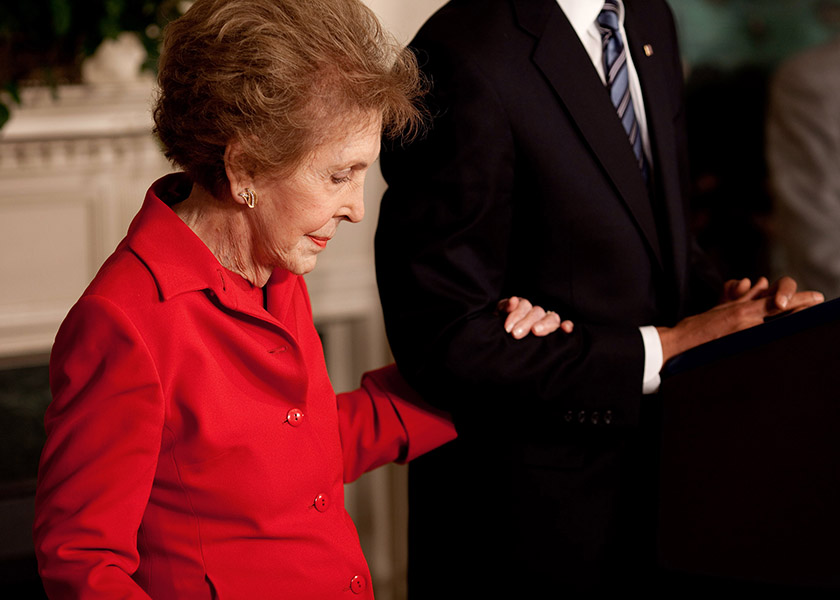 Former First Lady Nancy Reagan died Sunday at 94. This photo was taken as Nancy Reagan embraces President Barack Obama's arm at the podium as he announced and signed the Ronald Reagan Centennial Commission Act in the Diplomatic Room of the White House, June 2, 2009. (Pete Souza/The White House)