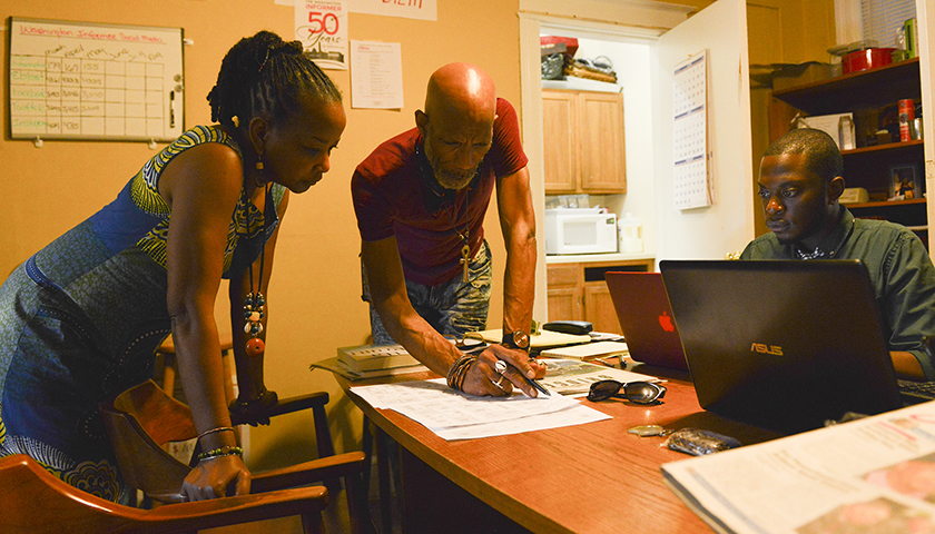 Denise Rolark Barnes (left), publisher of The Washington Informer and chair of the National Newspaper Publishers Association, D. Kevin McNeir (center), the editor of The Washington Informer, and Rushawn Walters, a NNPA/DTU journalism fellow discuss upcoming story assignments and events at The Washington Informer office in Southeast, Washington, D.C. (Freddie Allen/AMG/NNPA)