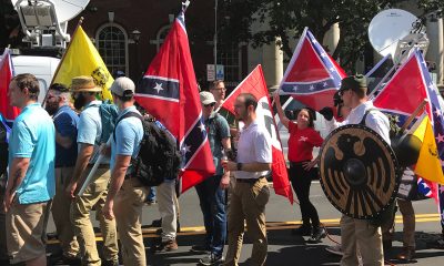 Alt-right members preparing to enter Emancipation Park holding Nazi, Confederate, and Gadsden “Don’t Tread on Me” flags in Charlottesville, Va. (Anthony Crider/Wikimedia Commons)