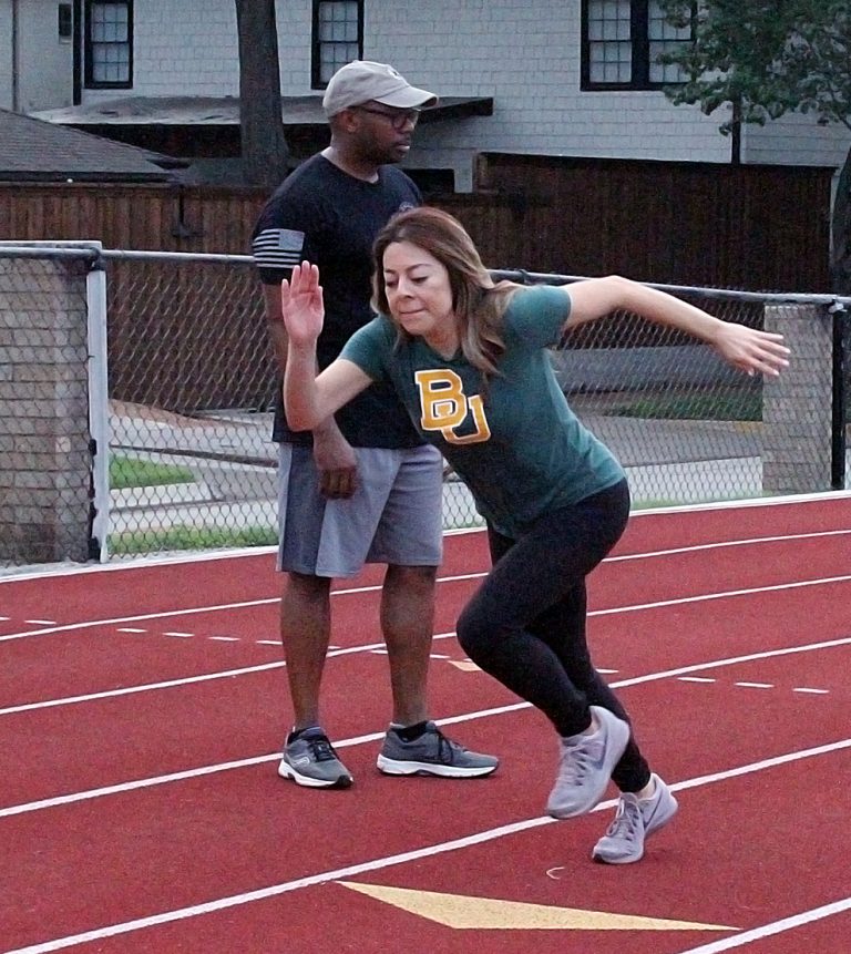 MaryAnn Martinez of CBS11 takes off at the start of a 300-meter sprint, one of four FBI physical fitness tests to screen potential applicants. (Photo: David Wilfong / NDG)