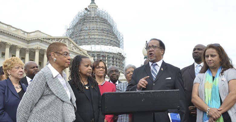 Congresswoman Eleanor Holmes Norton stands with NNPA President and CEO Dr. Benjamin F. Chavis Jr., and members of the Black and Hispanic press at a news conference on Capitol Hill in 2016/Washington Informer Photo