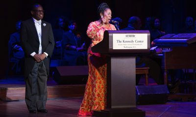 Gospel Music Advocate and Gospel Music Heritage Month Foundation Chairman Carl Davis with Congresswoman Sheila Jackson Lee (D-TX) on stage at the 2018 Evolution of Gospel Tribute to Aretha Franklin at the Kennedy Center for the Performing Arts (Photo by Brian Stukes)