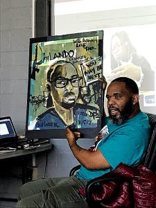Demont “Picasso” Pinder, whose paintings often depict victims of violence throughout the country and the world, says his “calling is using my God given gift to bring a smile to the families that have gone through this tragic situation.” / Photo by DR Barnes