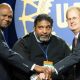 UAW Secretary-Treasurer Ray Curry, Reverend William Barber II, and UAW President Gary Jones stand in solidarity following Rev. Barber's speech on equality.