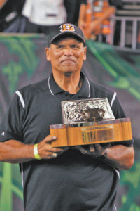 Bengals Hall of Famer Anthony Munoz held the 1988 A.F.C championship trophy when the Super Bowl team was introduced. Photo by Michael Mitchell